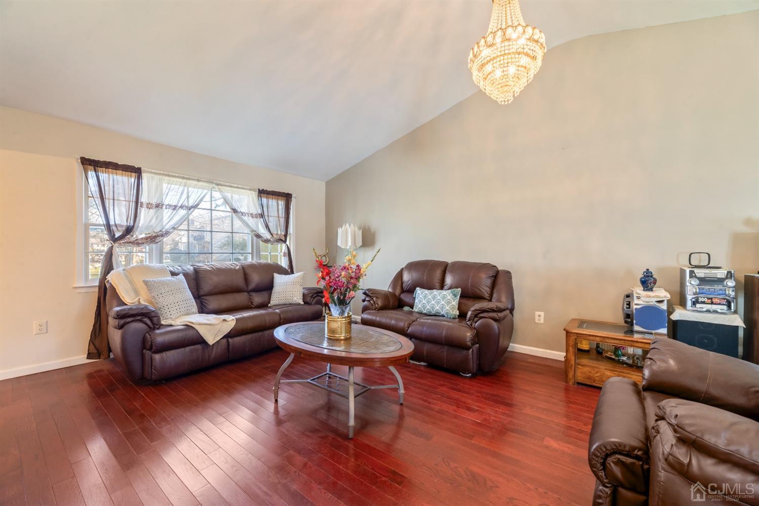 7 Prescott Road East Brunswick, NJ 08816 - Photo 6 of 30 a living room with furniture a rug and a window