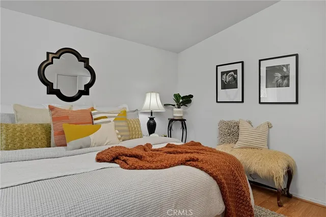 a bedroom with a bed and dresser