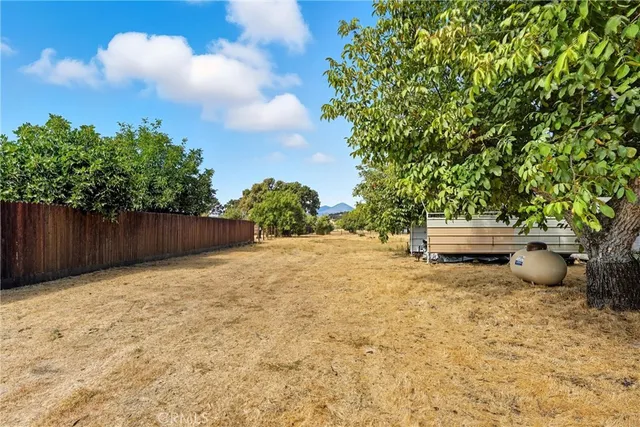 a backyard of a house with lots of green space