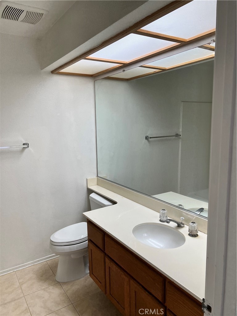 1409 Bodega Way, Unit 4 Diamond Bar, CA 91765 - Photo 14 of 15 a bathroom with a sink toilet and a mirror