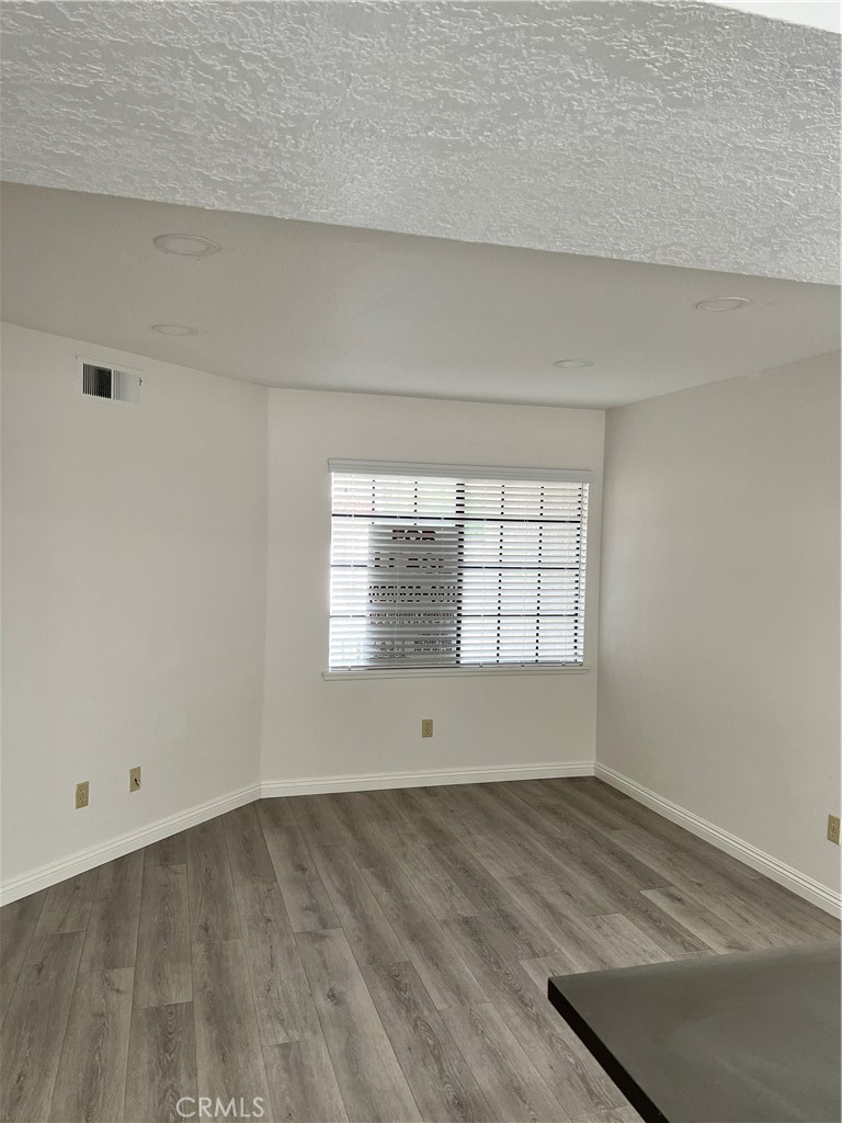 1409 Bodega Way, Unit 4 Diamond Bar, CA 91765 - Photo 3 of 15 a view of empty room with wooden floor and fan
