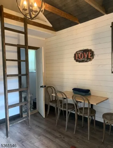 a view of a patio with table and chairs