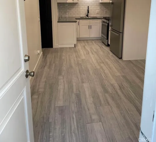 a view of a kitchen from the hallway