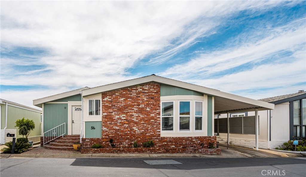 23301 Ridge Rte Drive, Unit 56 Laguna Hills, CA 92653 - Photo 1 of 44 front view of a house with a yard