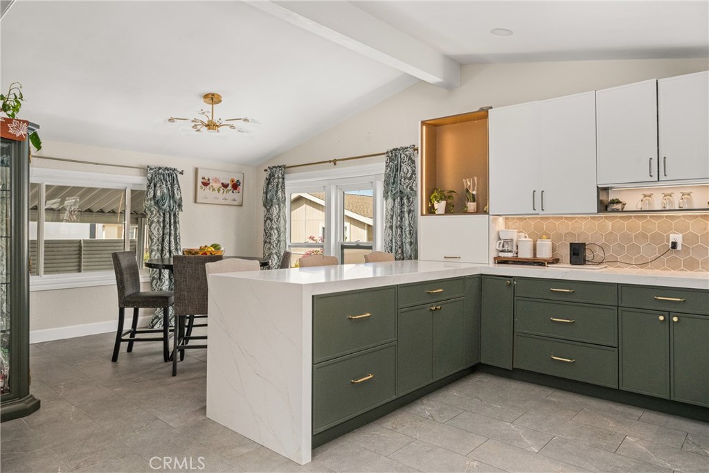 23301 Ridge Rte Drive, Unit 56 Laguna Hills, CA 92653 - Photo 12 of 44 a kitchen with cabinets a sink and appliances