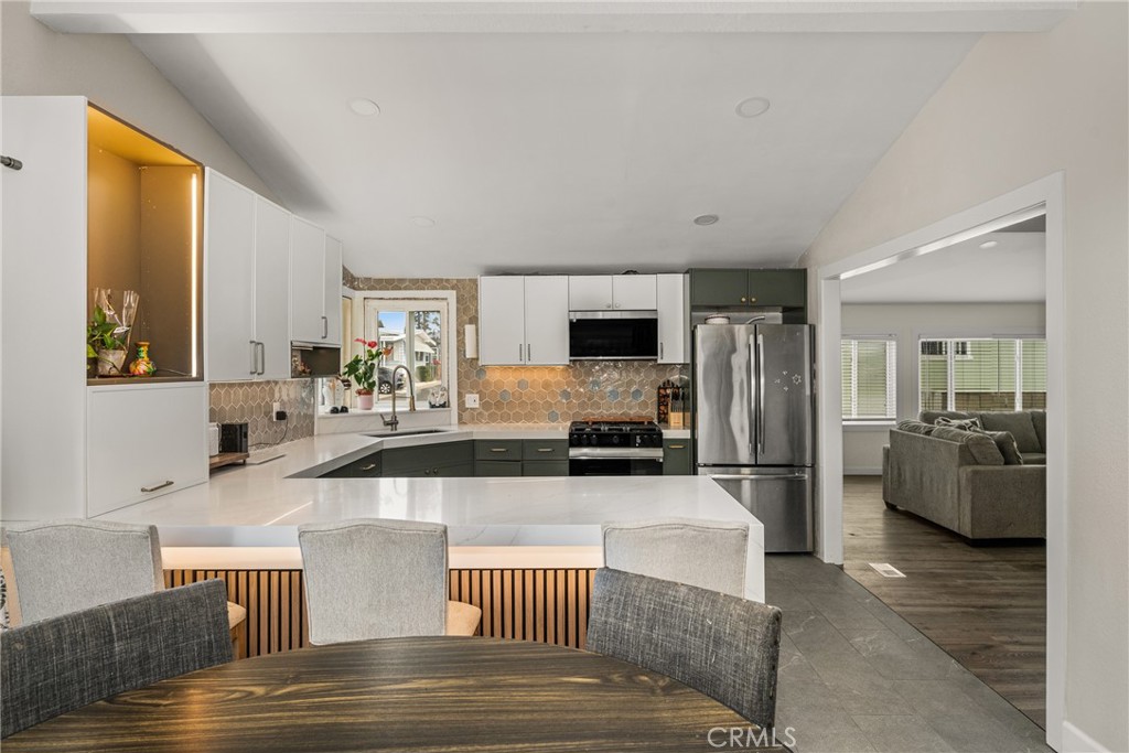 23301 Ridge Rte Drive, Unit 56 Laguna Hills, CA 92653 - Photo 16 of 44 a living room with furniture and a flat screen tv