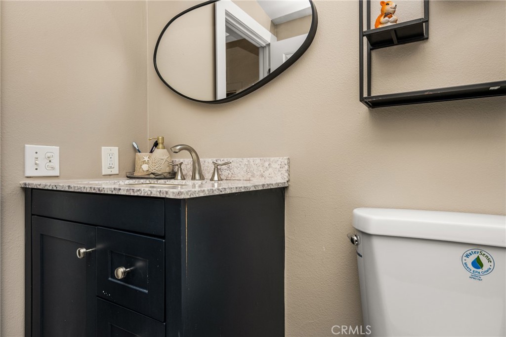 23301 Ridge Rte Drive, Unit 56 Laguna Hills, CA 92653 - Photo 23 of 44 a bathroom with a sink and a mirror