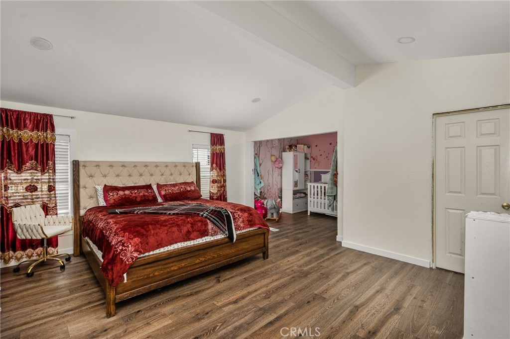 23301 Ridge Rte Drive, Unit 56 Laguna Hills, CA 92653 - Photo 25 of 44 a bedroom with a bed and a couch