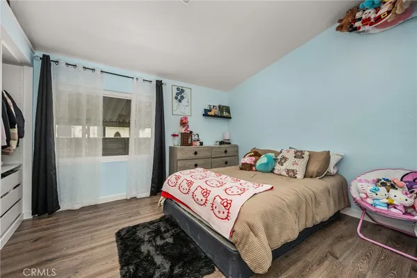 a bedroom with a bed and cabinets