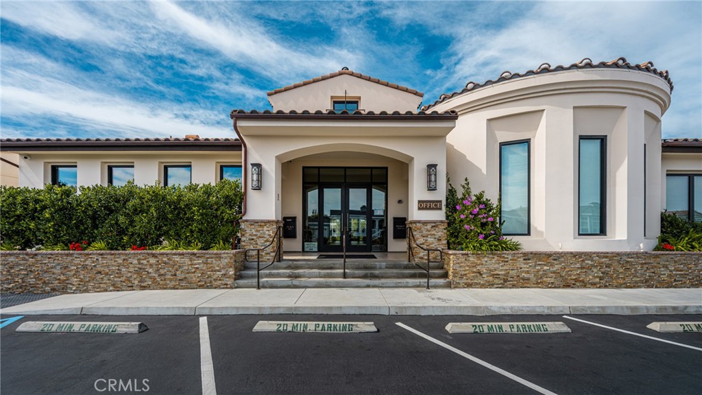 23301 Ridge Rte Drive, Unit 56 Laguna Hills, CA 92653 - Photo 36 of 44 a front view of a house with garden