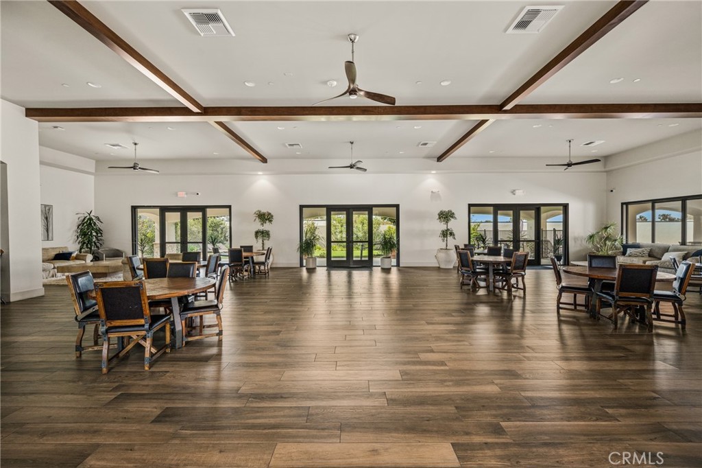 23301 Ridge Rte Drive, Unit 56 Laguna Hills, CA 92653 - Photo 39 of 44 a view of a dining room with furniture wooden floor and chandelier