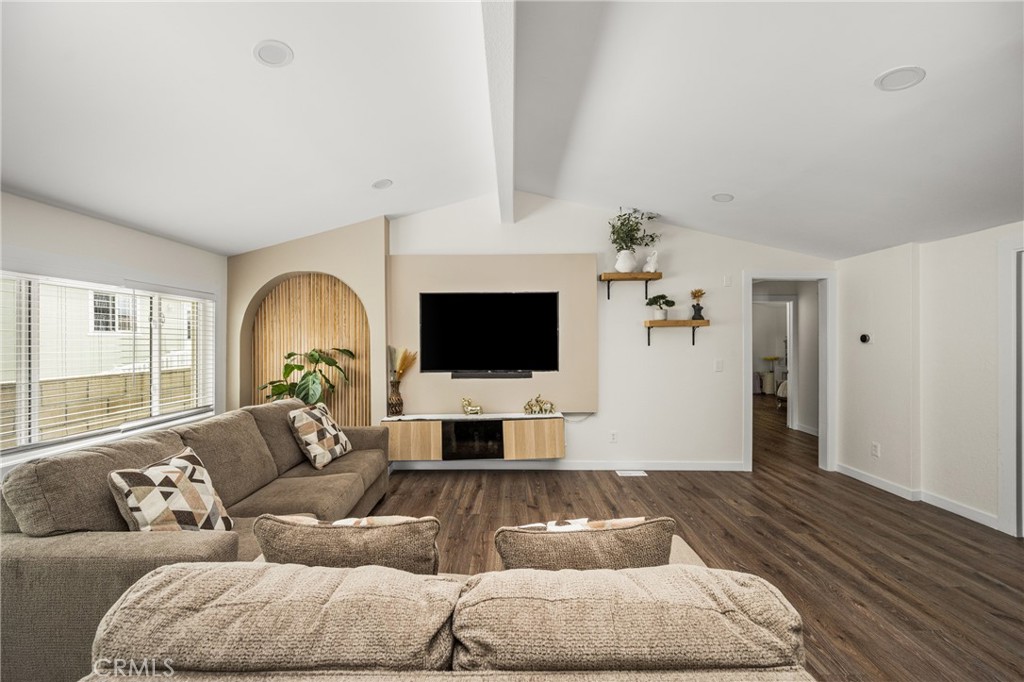 23301 Ridge Rte Drive, Unit 56 Laguna Hills, CA 92653 - Photo 4 of 44 a living room with furniture and a flat screen tv