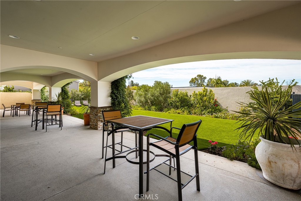 23301 Ridge Rte Drive, Unit 56 Laguna Hills, CA 92653 - Photo 42 of 44 a view of a porch with furniture and garden