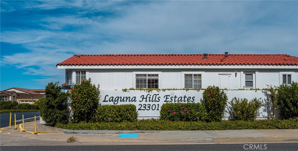 23301 Ridge Rte Drive, Unit 56 Laguna Hills, CA 92653 - Photo 44 of 44 a front view of a house with garage