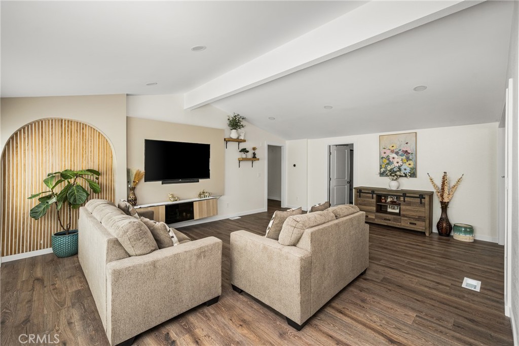 23301 Ridge Rte Drive, Unit 56 Laguna Hills, CA 92653 - Photo 6 of 44 a living room with furniture and a flat screen tv