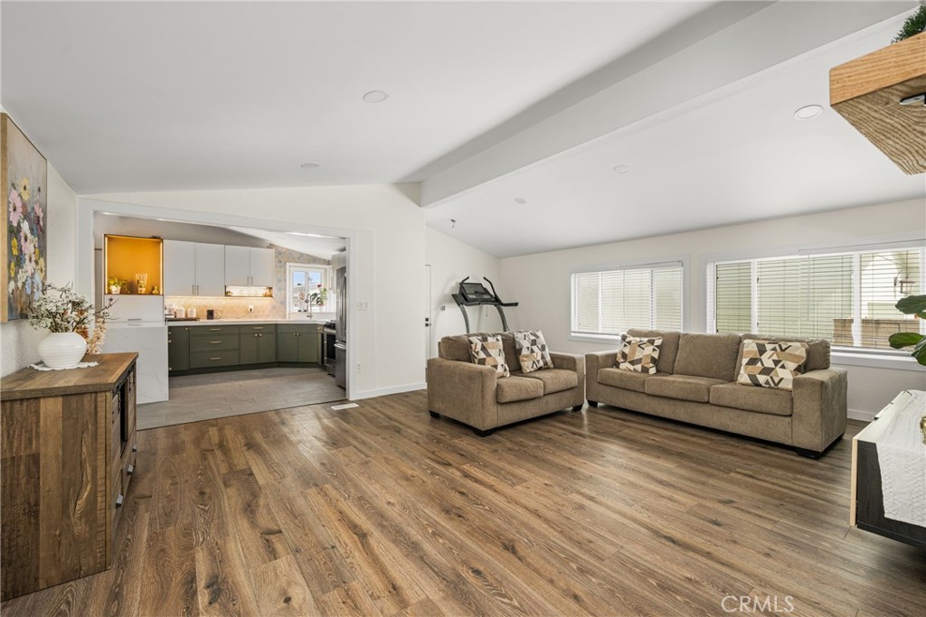 23301 Ridge Rte Drive, Unit 56 Laguna Hills, CA 92653 - Photo 7 of 44 a living room with furniture and a wooden floor