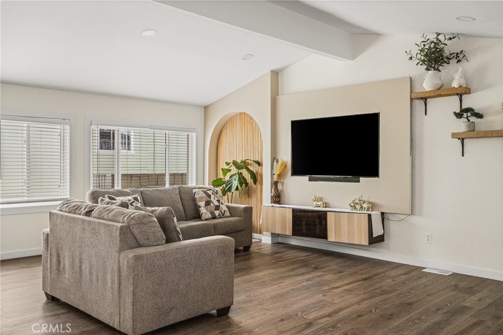 23301 Ridge Rte Drive, Unit 56 Laguna Hills, CA 92653 - Photo 9 of 44 a living room with furniture and a flat screen tv