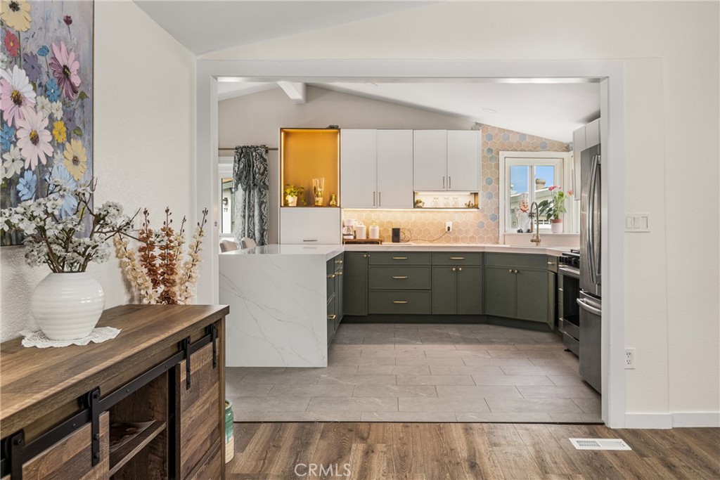 23301 Ridge Rte Drive, Unit 56 Laguna Hills, CA 92653 - Photo 10 of 44 a view of kitchen with stainless steel appliances cabinets and a potted plant