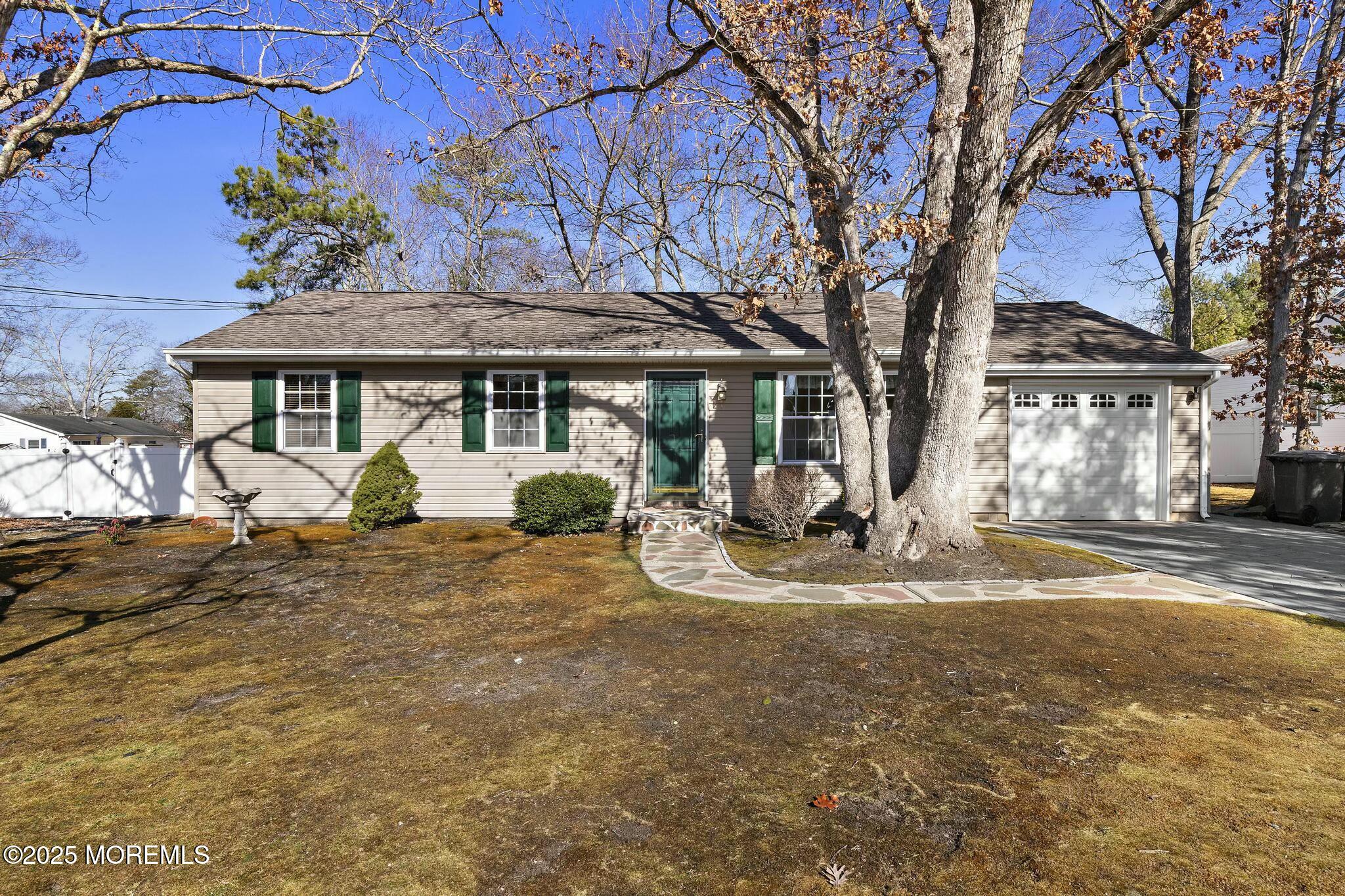 176 Riptide Avenue Manahawkin, NJ 08050 - Photo 1 of 13 a view of a house with backyard and a tree