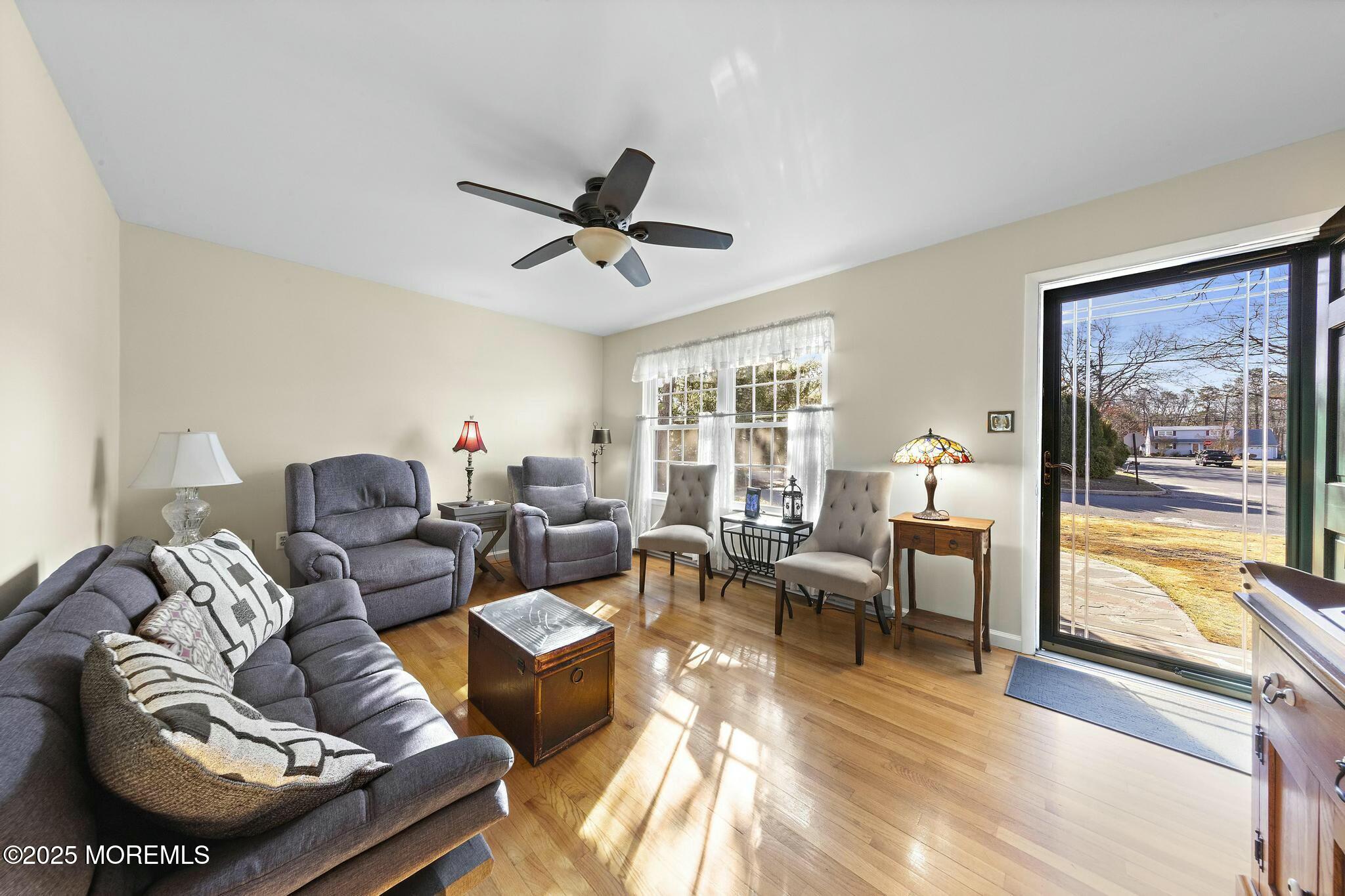 176 Riptide Avenue Manahawkin, NJ 08050 - Photo 2 of 13 a living room with furniture and a large window