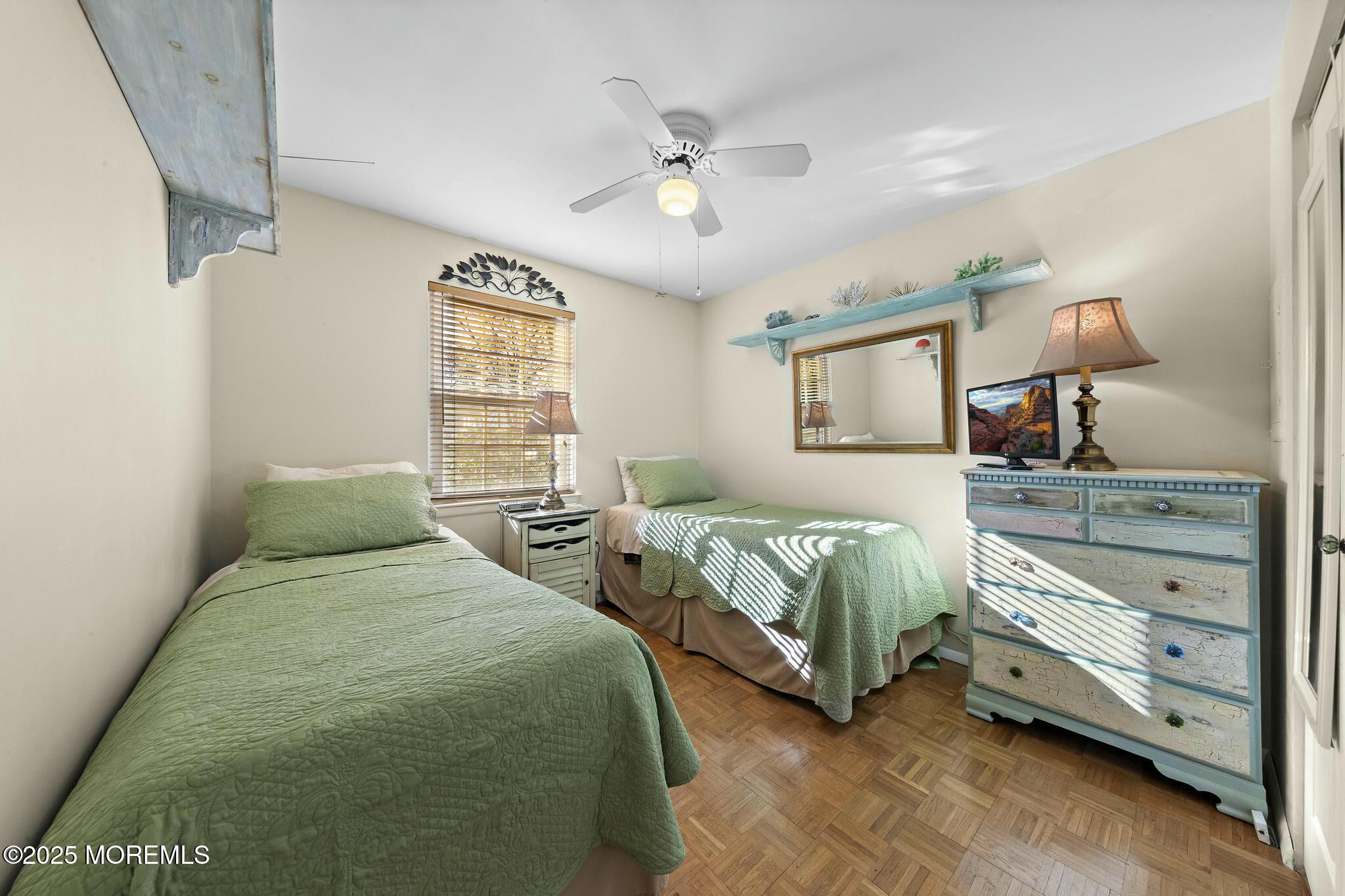 176 Riptide Avenue Manahawkin, NJ 08050 - Photo 7 of 13 a bedroom with two beds and painting on the wall