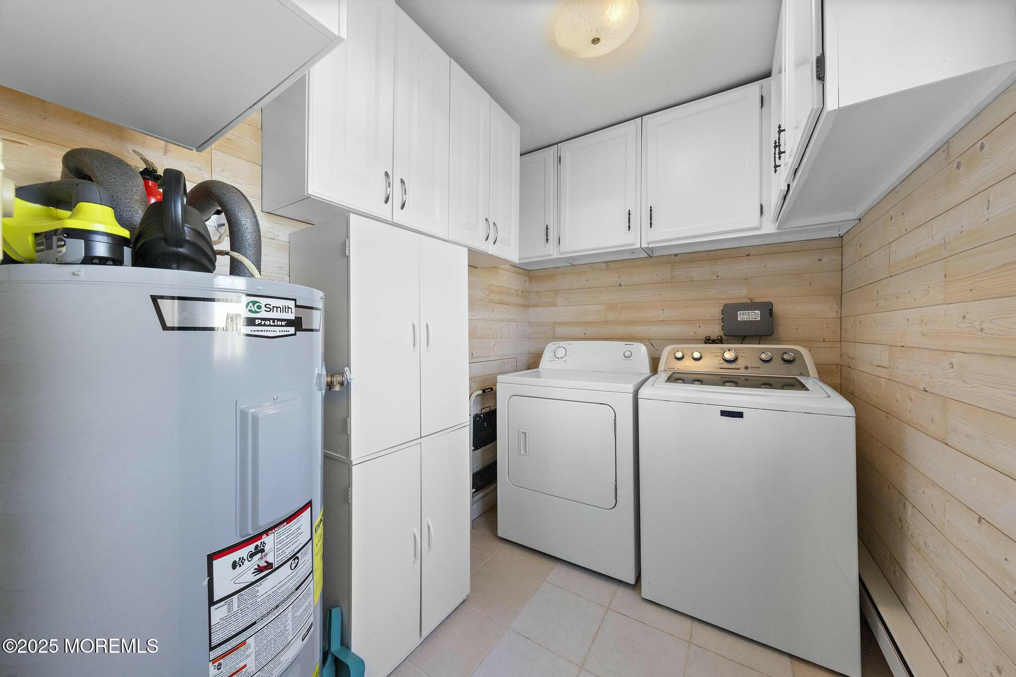 176 Riptide Avenue Manahawkin, NJ 08050 - Photo 9 of 13 a utility room with dryer and washer