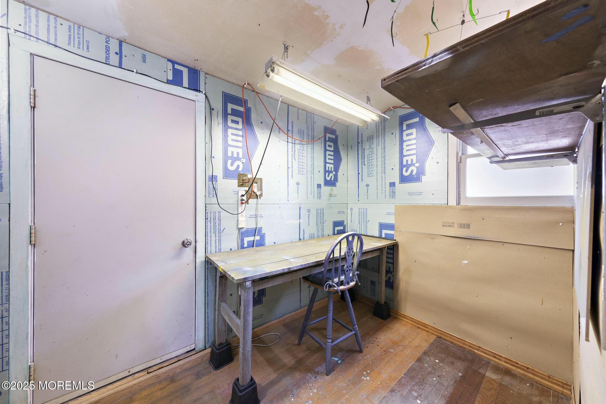 176 Riptide Avenue Manahawkin, NJ 08050 - Photo 10 of 13 a view of a kitchen with furniture and a refrigerator