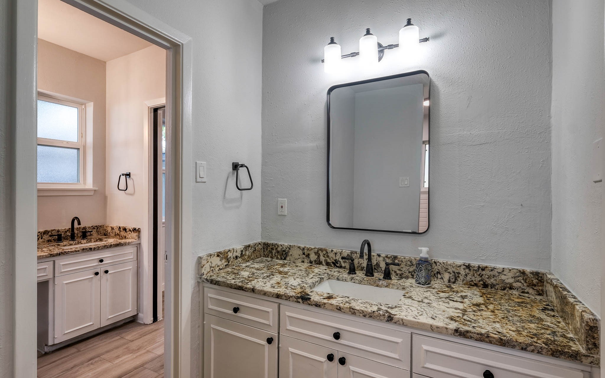 20515 Kickapoo Road Waller, TX 77484 - Photo 17 of 50 a bathroom with a sink and a mirror