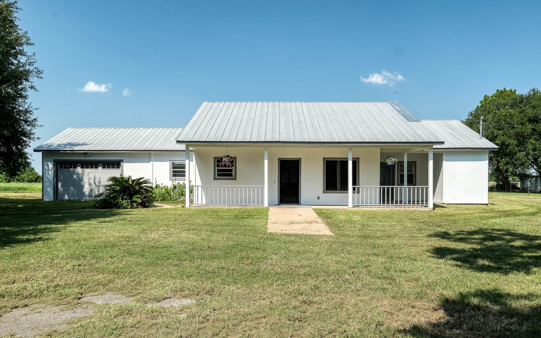20515 Kickapoo Road Waller, TX 77484 - Photo 30 of 50 a front view of a house with a garden