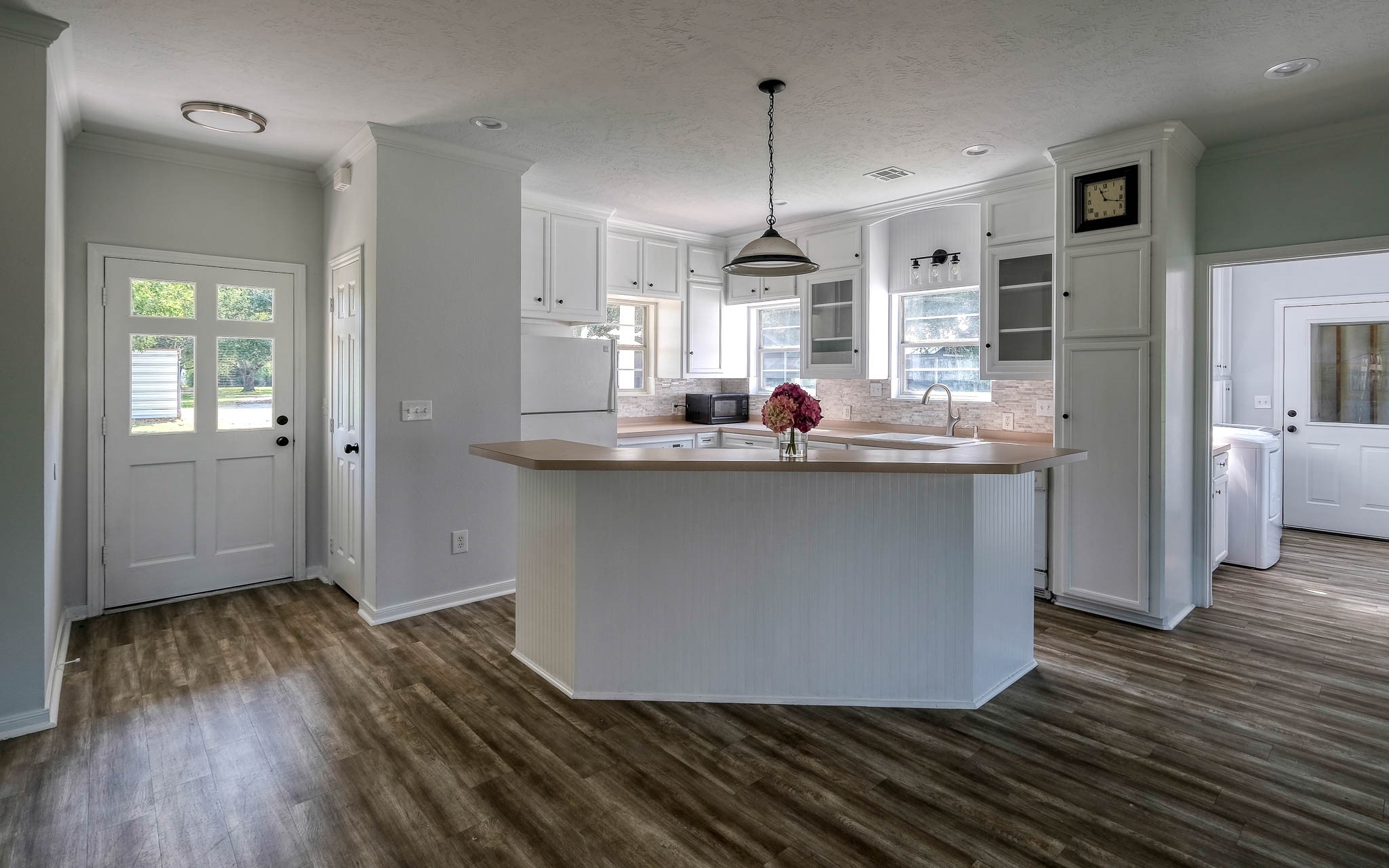 20515 Kickapoo Road Waller, TX 77484 - Photo 33 of 50 a kitchen with stainless steel appliances granite countertop a sink window and wooden floor