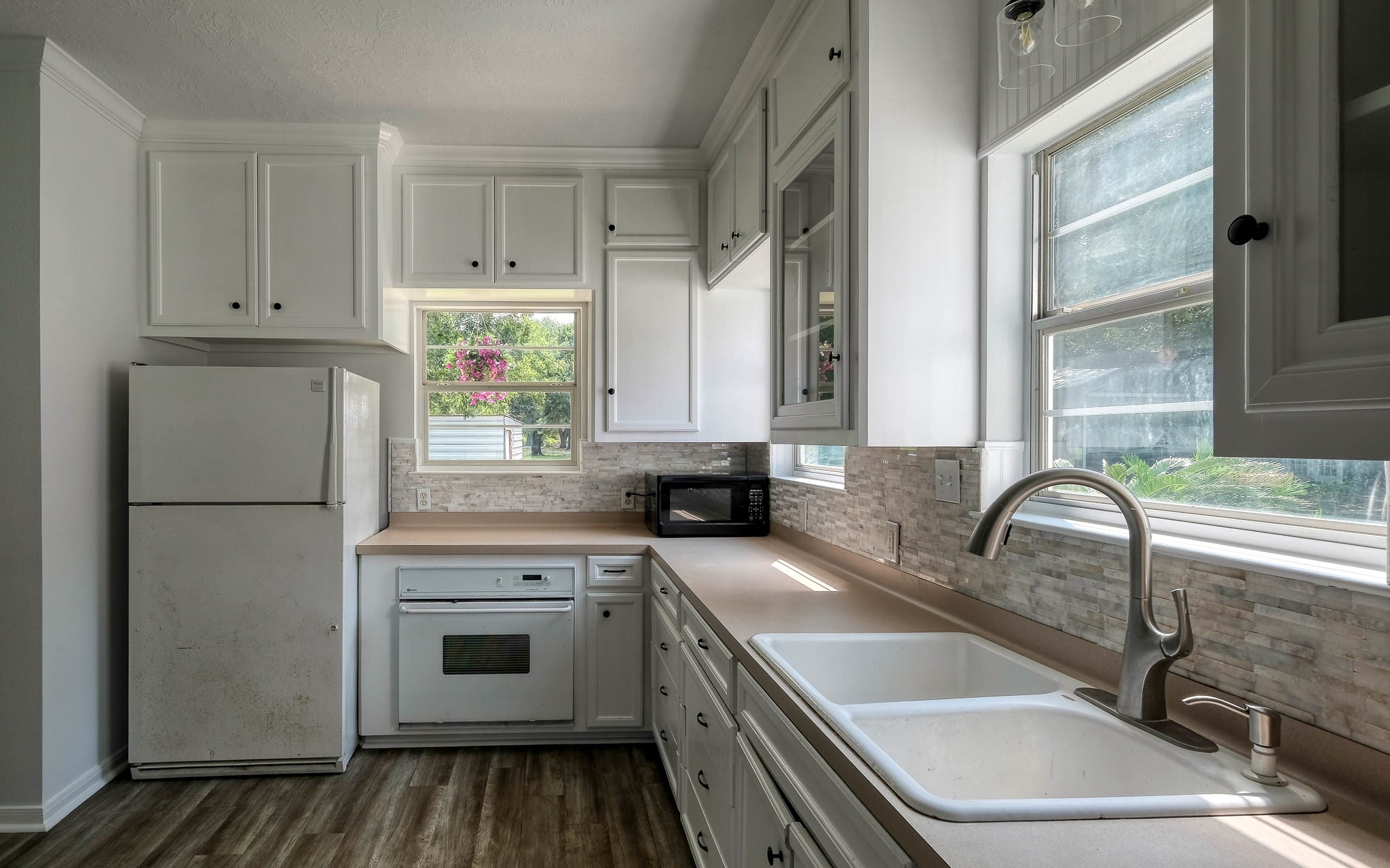20515 Kickapoo Road Waller, TX 77484 - Photo 35 of 50 a kitchen with a sink cabinets and window