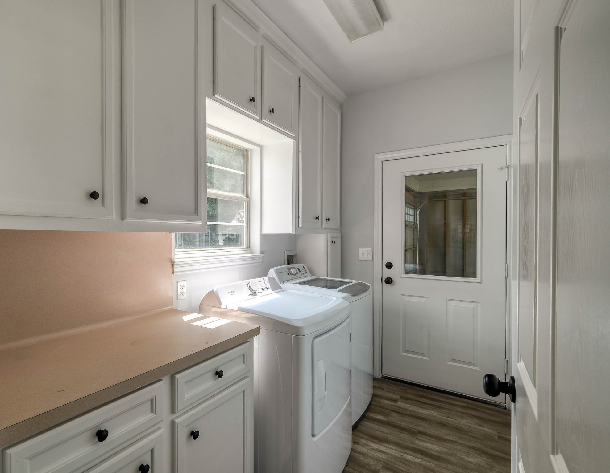 20515 Kickapoo Road Waller, TX 77484 - Photo 46 of 50 a utility room with cabinets washer and dryer