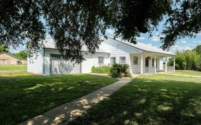 a view of an empty room with stairs