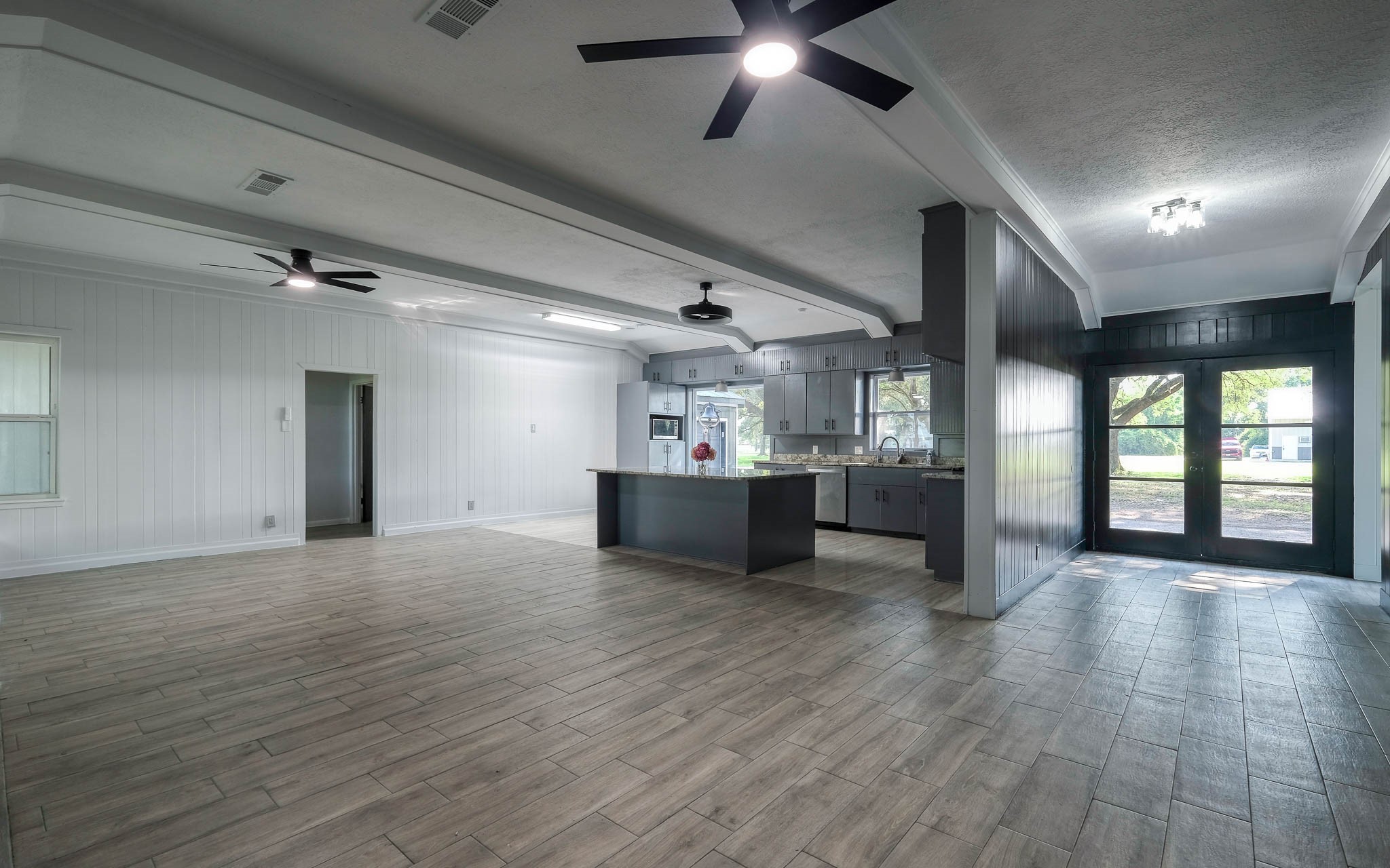 20515 Kickapoo Road Waller, TX 77484 - Photo 6 of 50 a view of an empty room with a window and wooden floor