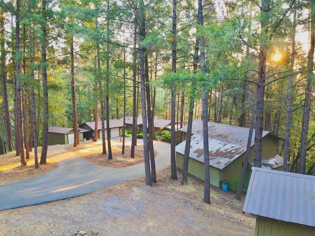 a view of a backyard with sitting area