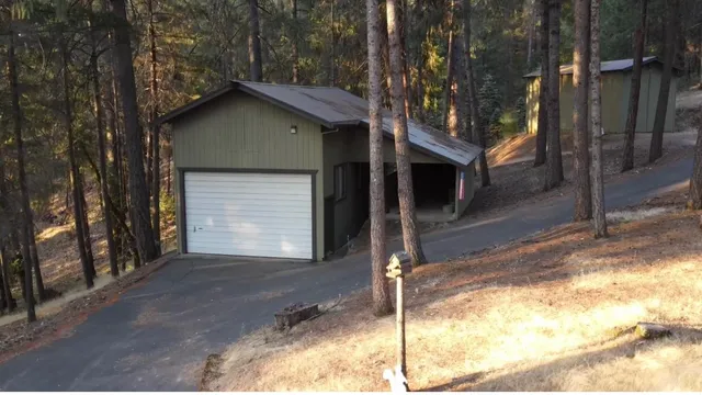 a house with trees in the background
