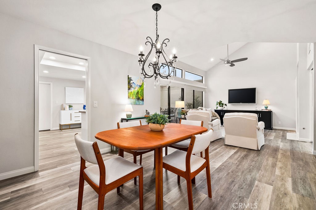 38 Navarre, Unit 138 Irvine, CA 92612 - Photo 14 of 33 a view of a dining room with furniture and wooden floor