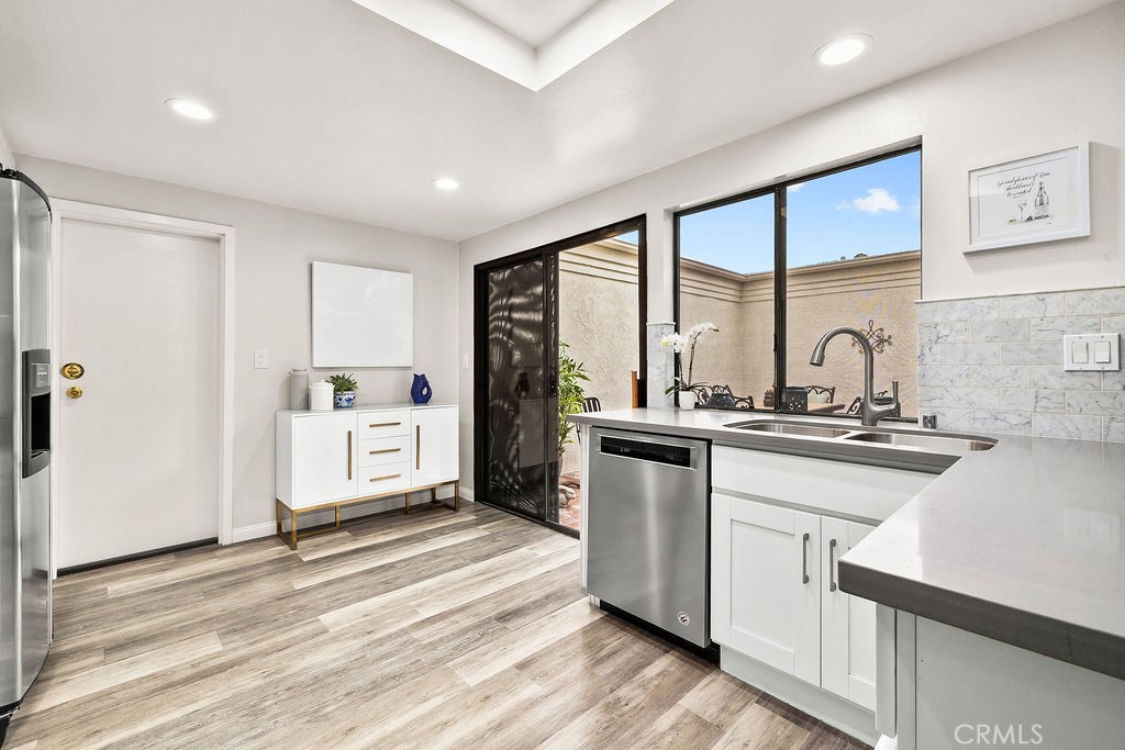38 Navarre, Unit 138 Irvine, CA 92612 - Photo 16 of 33 a kitchen with stainless steel appliances granite countertop a stove a sink and a refrigerator