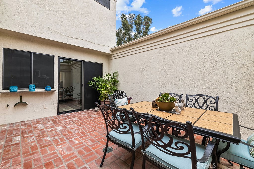 38 Navarre, Unit 138 Irvine, CA 92612 - Photo 17 of 33 a view of a chairs and table in the patio