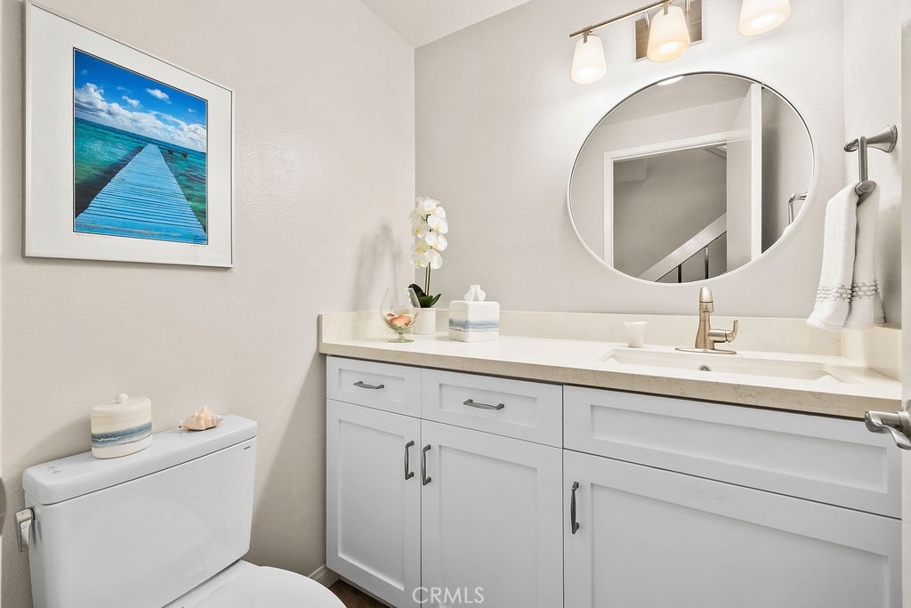 38 Navarre, Unit 138 Irvine, CA 92612 - Photo 22 of 33 a bathroom with a toilet a sink and mirror