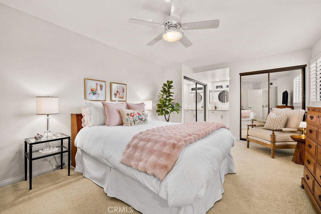 38 Navarre, Unit 138 Irvine, CA 92612 - Photo 24 of 33 a spacious bedroom with a bed and ceiling fan