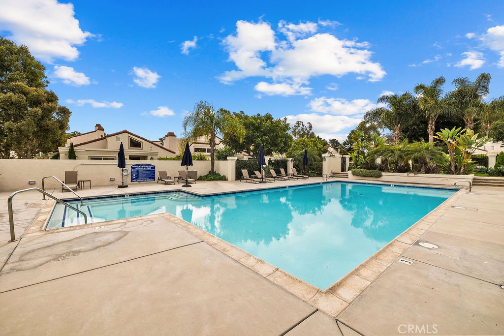 38 Navarre, Unit 138 Irvine, CA 92612 - Photo 31 of 33 a view of a swimming pool with a lounge chair