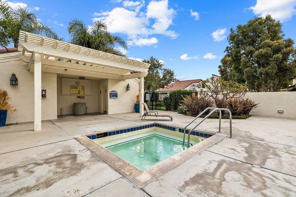 38 Navarre, Unit 138 Irvine, CA 92612 - Photo 32 of 33 a view of a swimming pool with a lounge chairs
