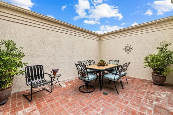 a outdoor living space with furniture and a potted plant