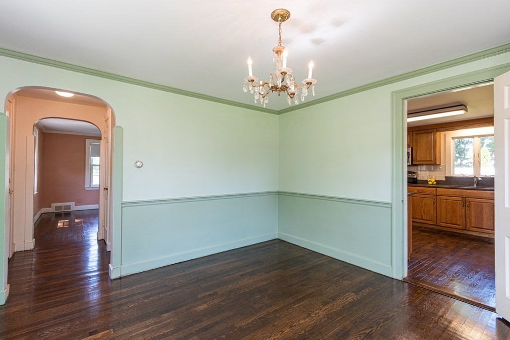 81 Fairview Avenue Lynnfield, MA 01940 - Photo 16 of 41 a view of a hallway with wooden floor and a kitchen