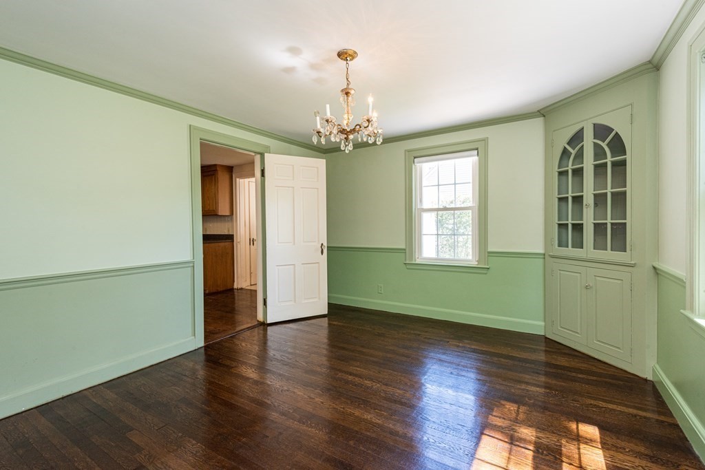 81 Fairview Avenue Lynnfield, MA 01940 - Photo 17 of 41 a view of an empty room with window and wooden floor