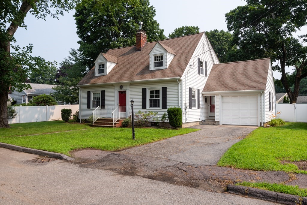 81 Fairview Avenue Lynnfield, MA 01940 - Photo 2 of 41 a front view of a house with a yard and garage