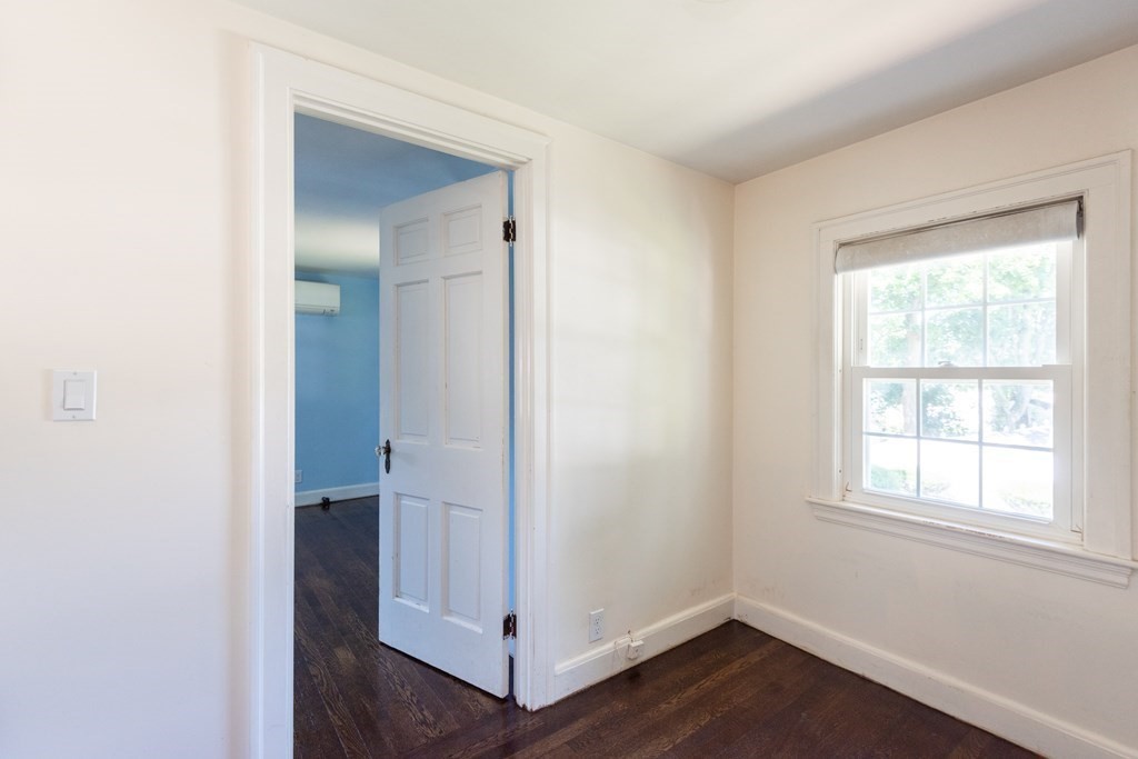 81 Fairview Avenue Lynnfield, MA 01940 - Photo 26 of 41 an empty room with wooden floor and a window