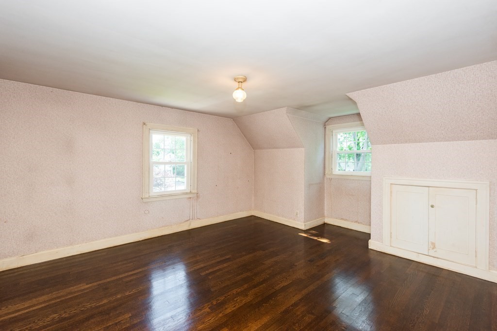 81 Fairview Avenue Lynnfield, MA 01940 - Photo 33 of 41 an empty room with wooden floor cabinet and windows