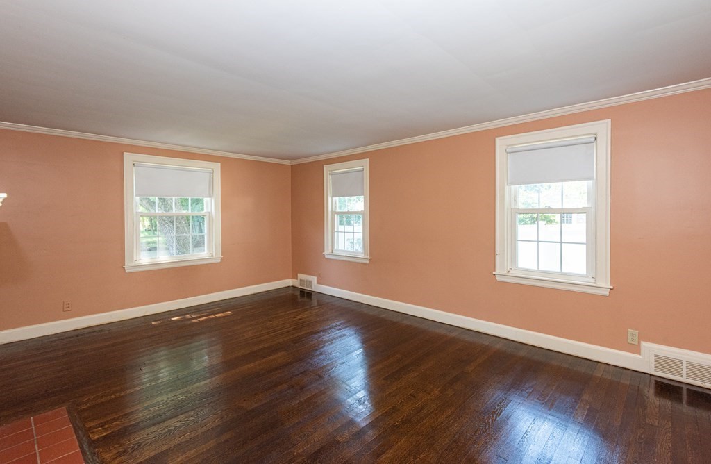81 Fairview Avenue Lynnfield, MA 01940 - Photo 8 of 41 a view of an empty room with wooden floor and a window